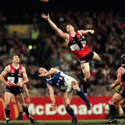Brett Cook of St Kilda wins the tap over John Longmire of North Melbourne during the AFL Second Preliminary Final between the St Kilda Saints and North Melbourne at the Melbourne Cricket Ground on September 19, 1997.
